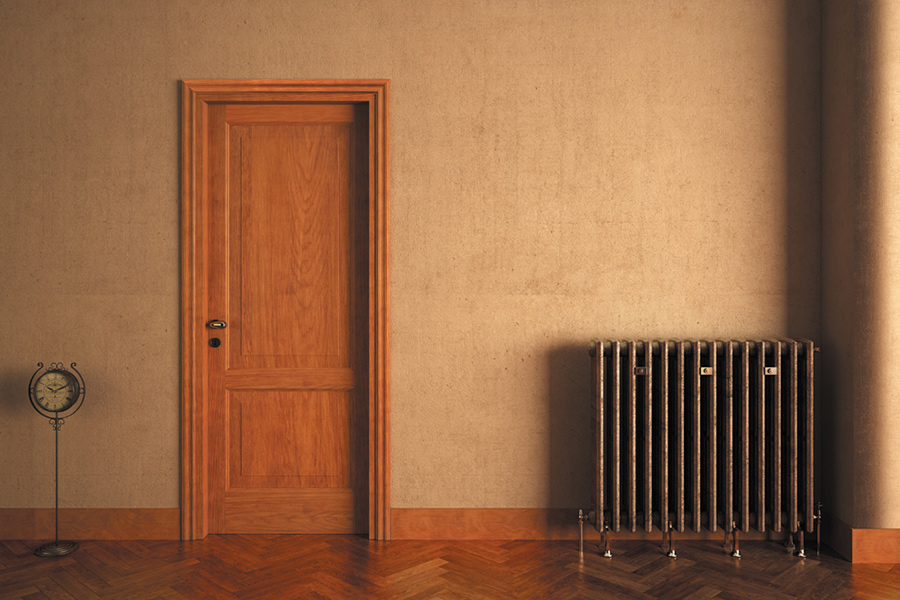 Palmieri Serramenti porta in legno classico, termosifone in ottone